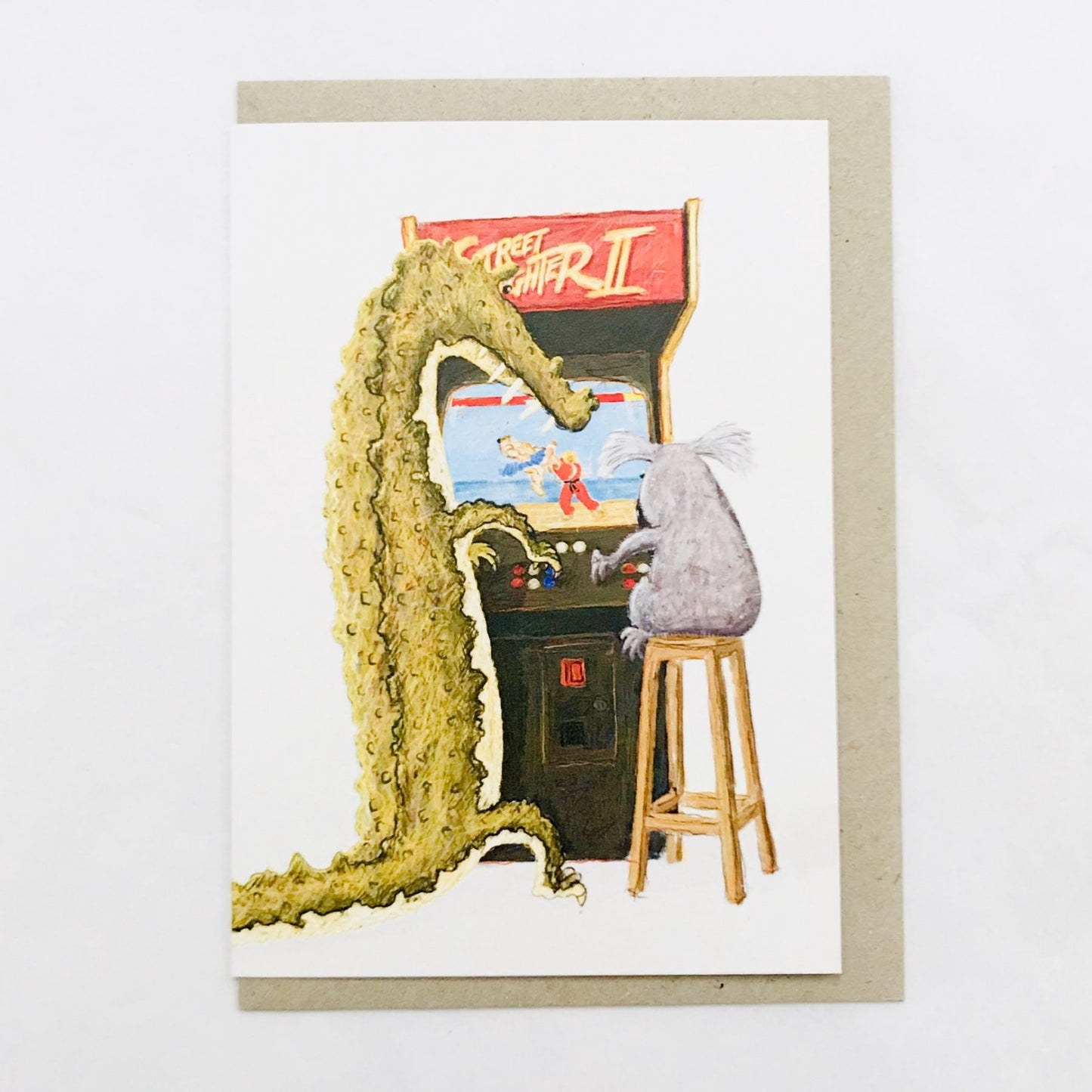 Beau Wylie Card Crocodile and Koala playing Street Fighter II arcade machine